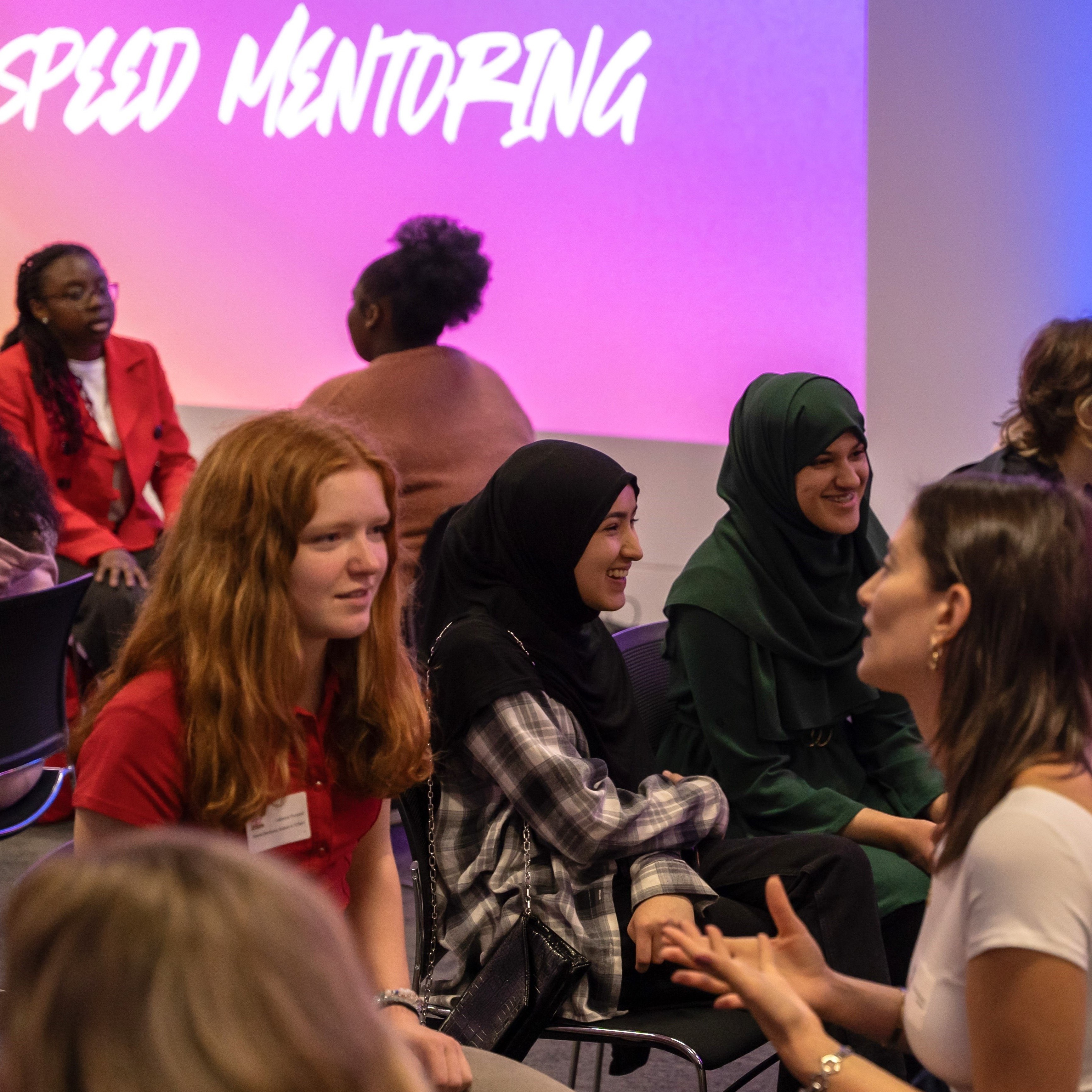 Pairs of women chatting during speed mentoring at Next Tech Fest 2025