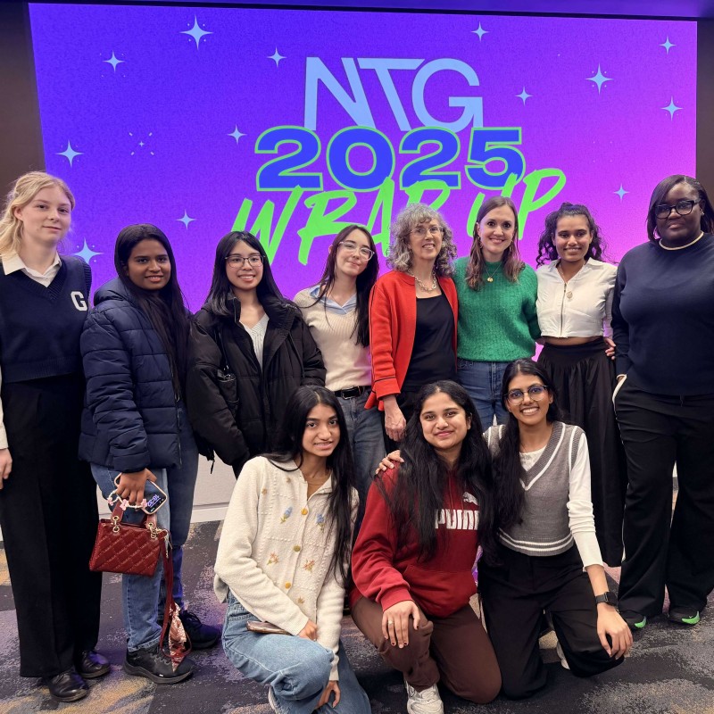 A group of University of Greenwich Student Ambassadors stand and smile for a photo with Emily from Next Tech Girls at the NTG 2025 Wrap Up event.
